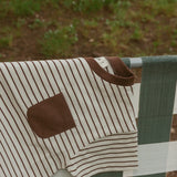 Cory Pocket Romper in Thin Chocolate Stripe